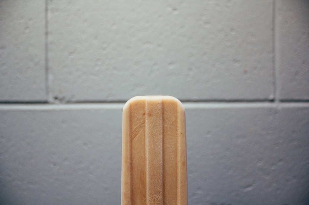 Creamy Peanut Butter "Pupsicle" against white tiles