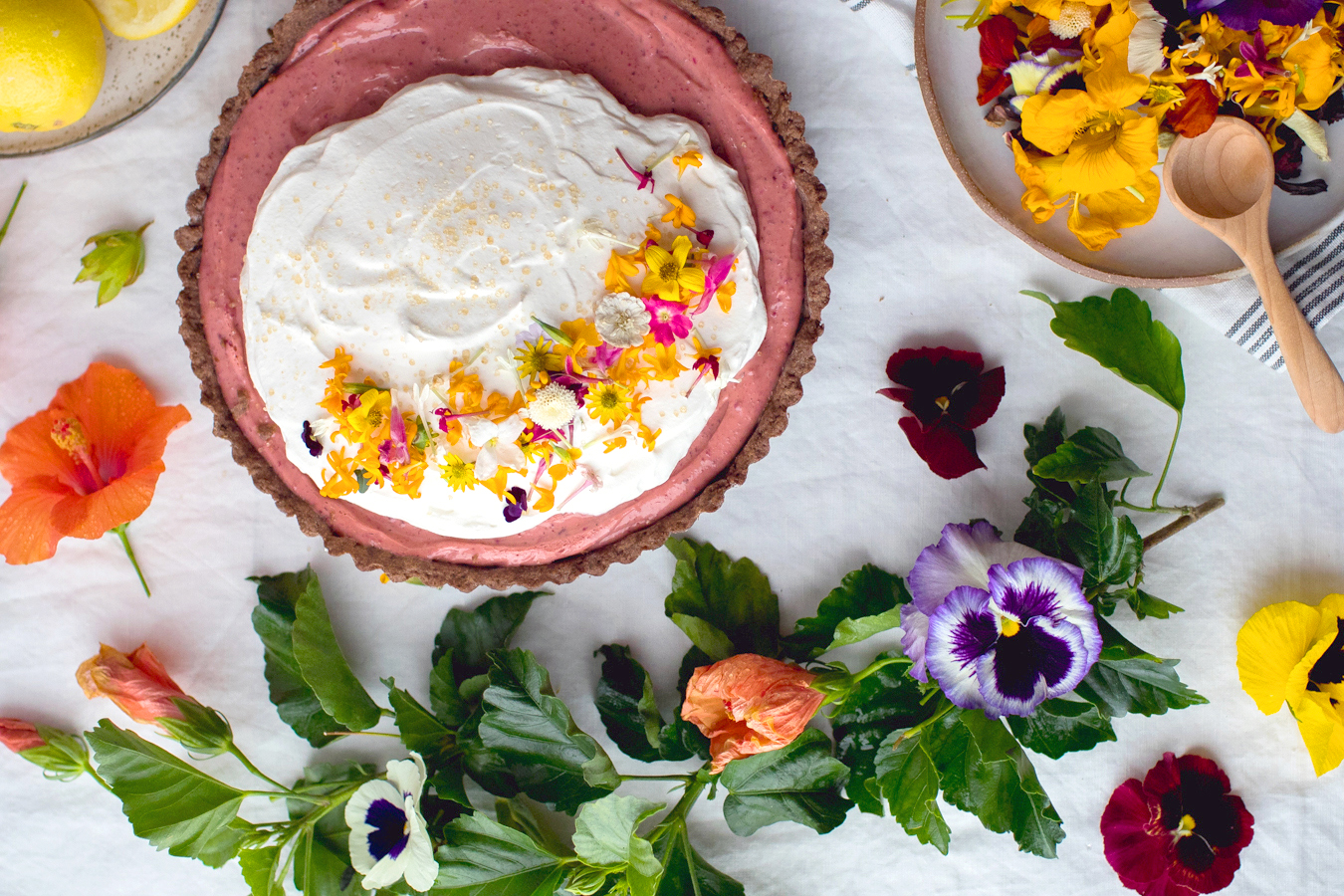 Granola with lemon yogurt and edible flowers