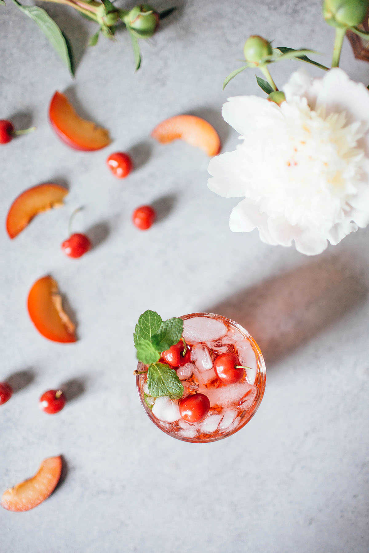 St. Germain Spritz garnished with cherries and fresh mint