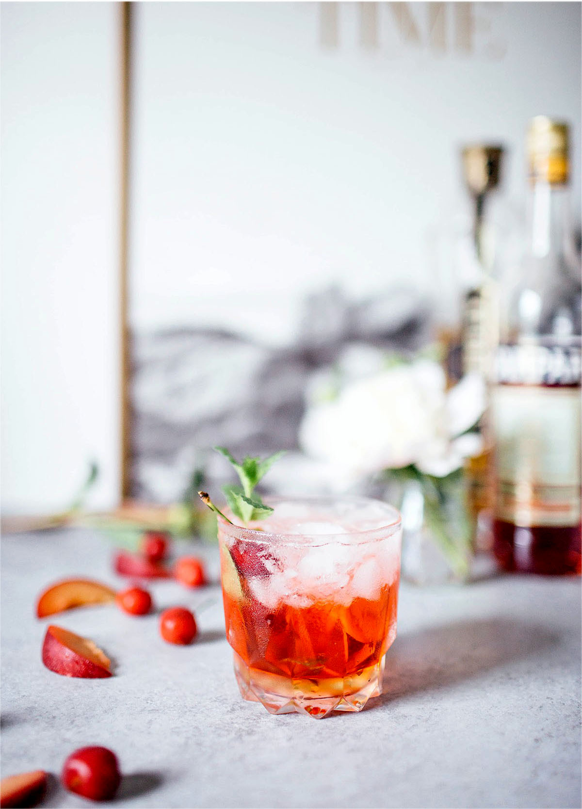 St. Germain Spritz garnished with cherries and fresh mint