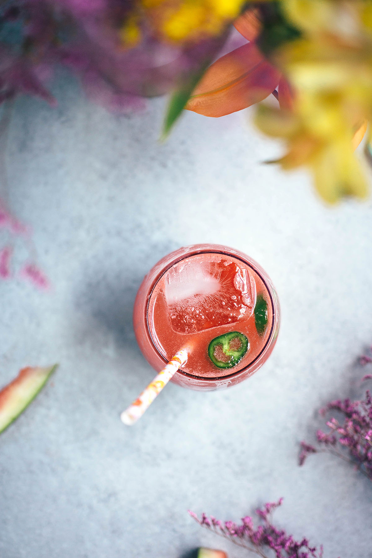 Spicy Watermelon Soda next to bouquet of flowers 