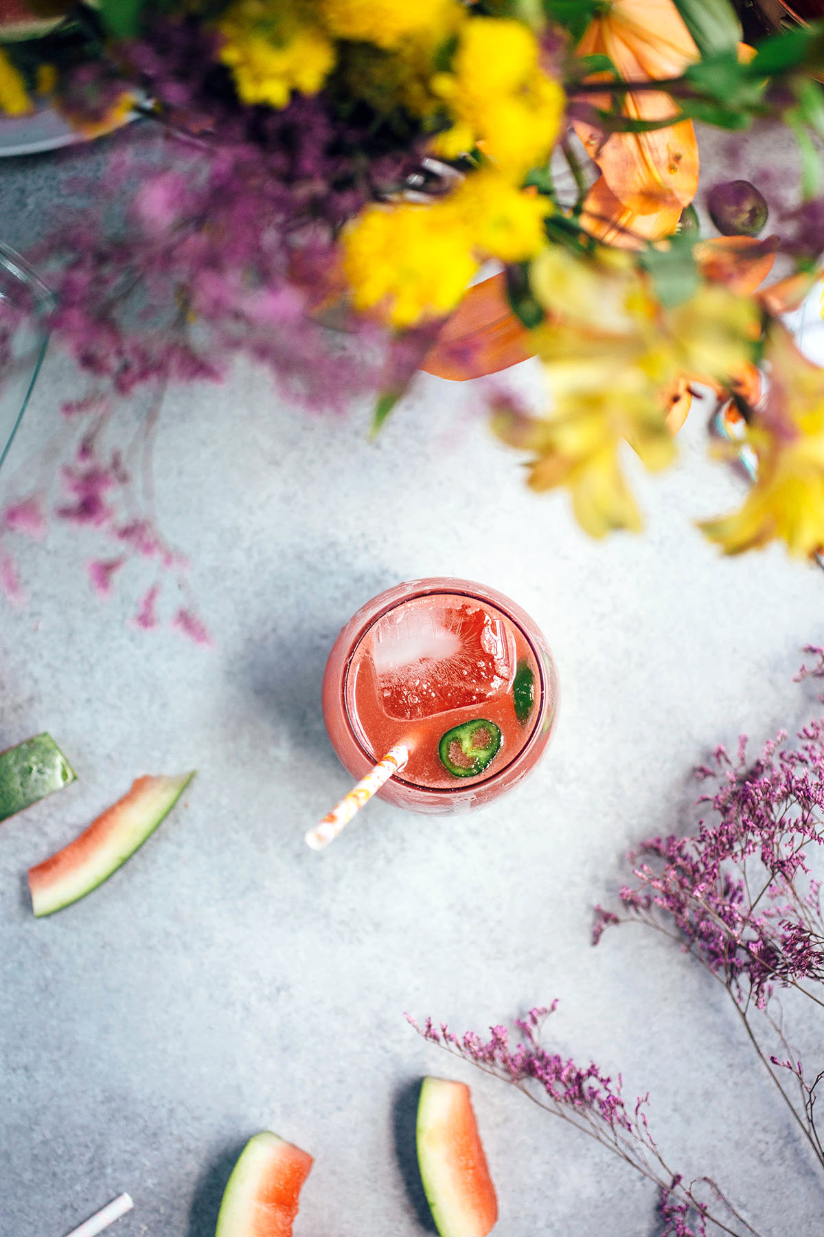 Spicy Watermelon Soda next to flower bouquet 