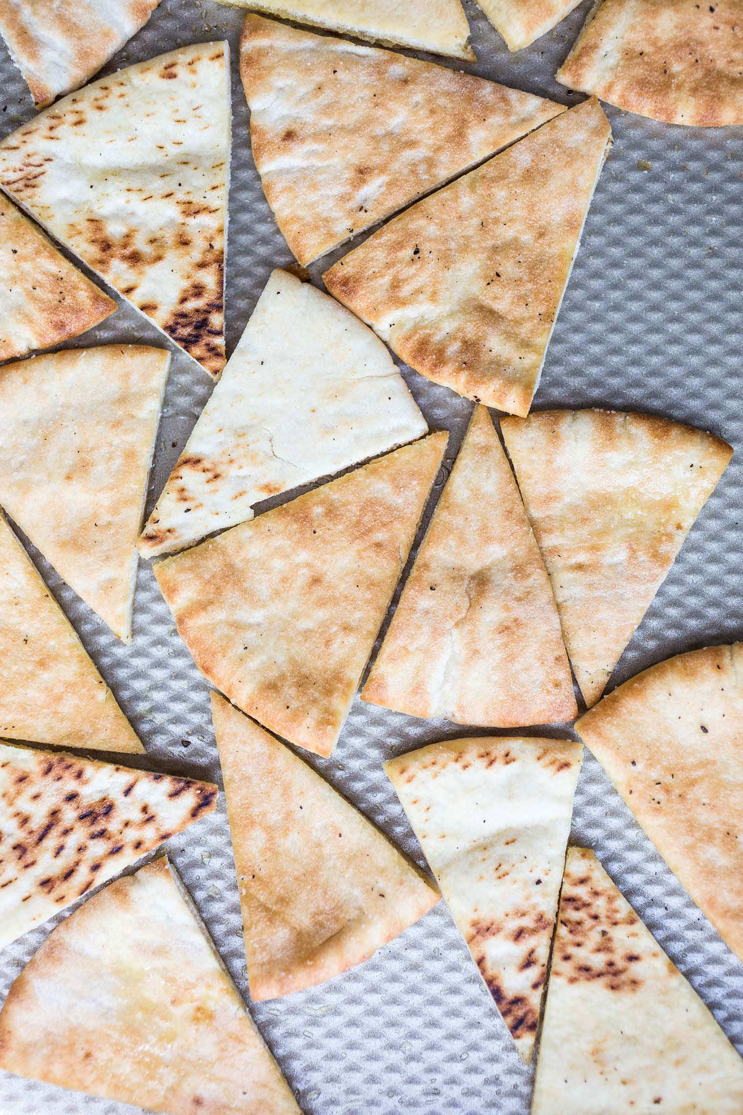 pita wedges on baking tray ready to be toasted