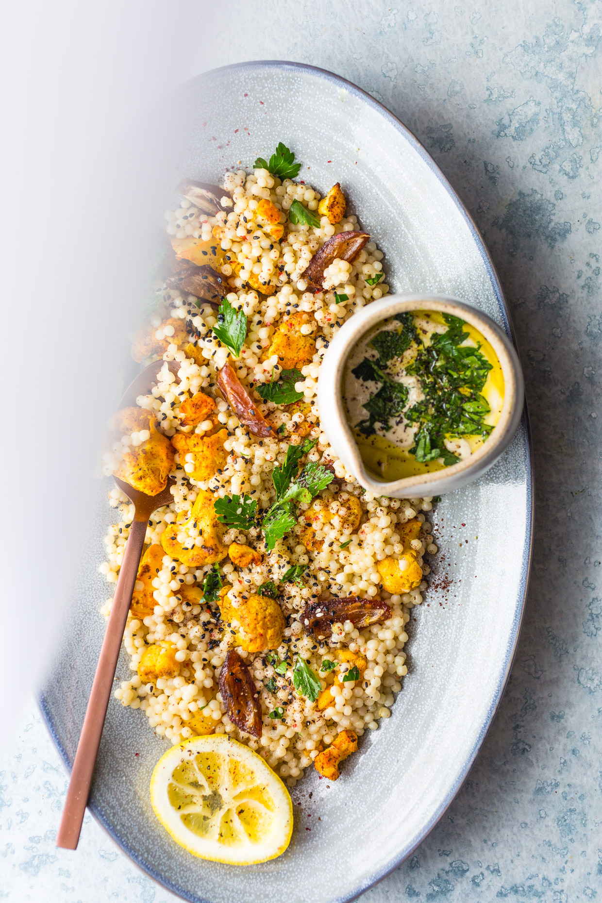 Roasted Cauliflower & Dates Couscous Salad with Creamy Tahini