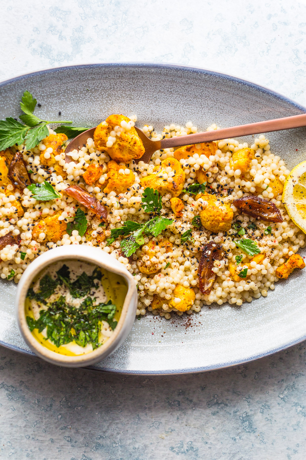 Roasted Cauliflower & Dates Couscous Salad with Creamy Tahini