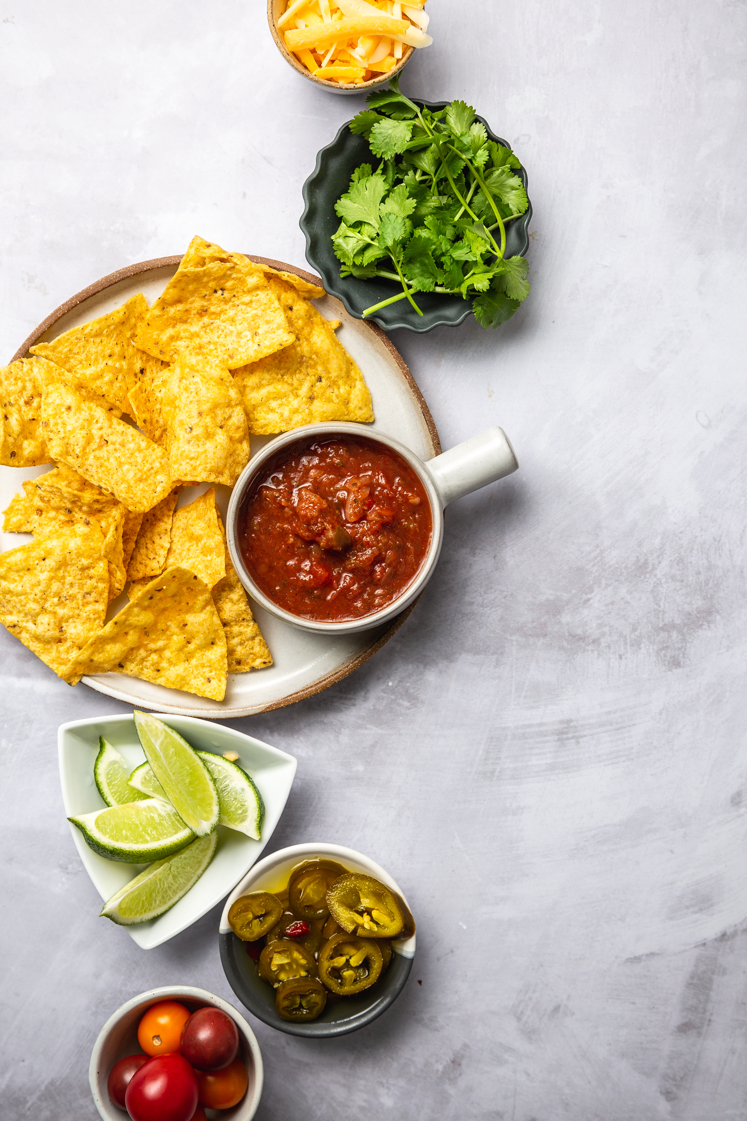 veggie nacho ingredients laid out on countertop 