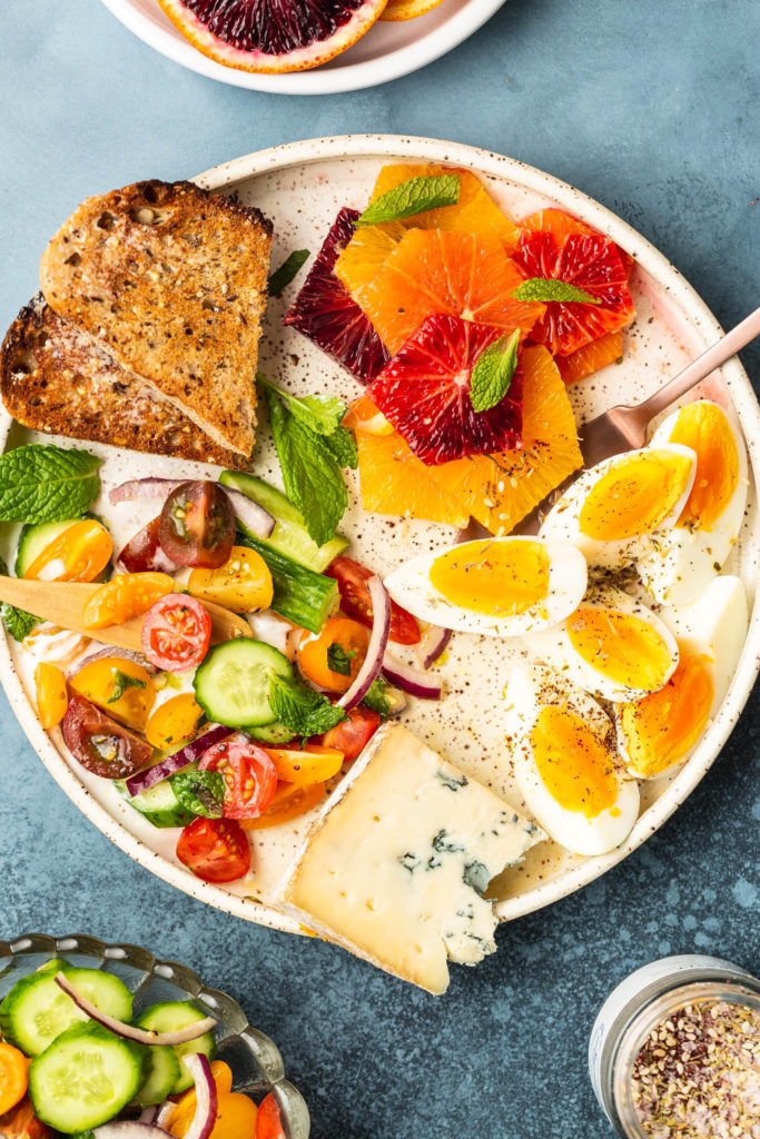 Vegetarian Breakfast Mezze Spread with Tomato Cucumber Salad & Za'atar Eggs