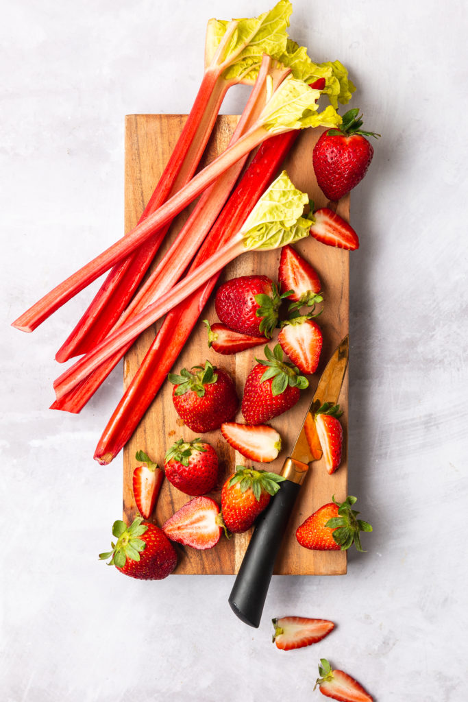 strawberry and rhubarb on cutting board