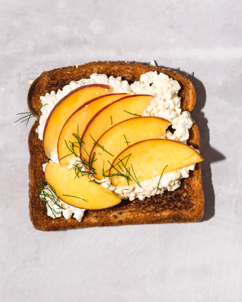 sliced peach, honey, and cottage cheese on toast