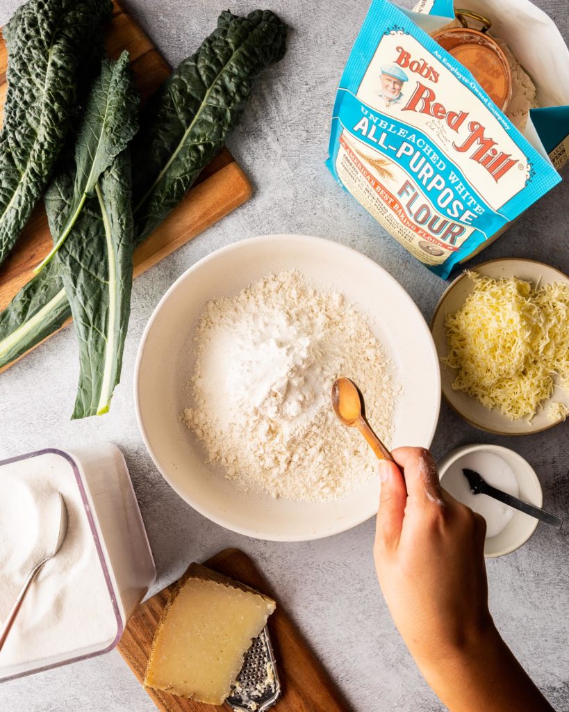 stirring dough for Cheesy Kale Scones with Manchego