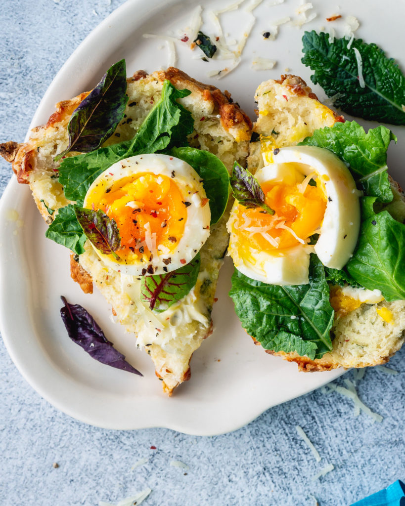 Cheesy Kale Scones with Manchego topped with egg and kale