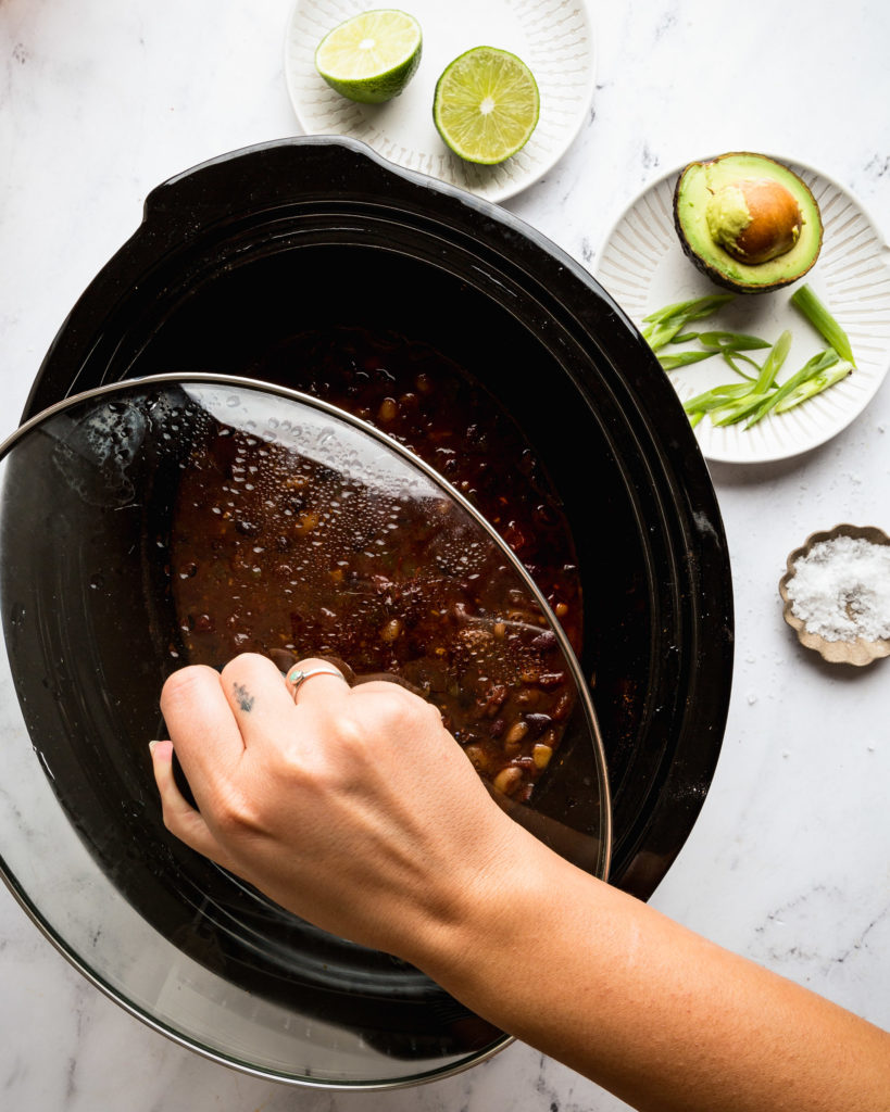 overhead of a slow cooker with chili in it