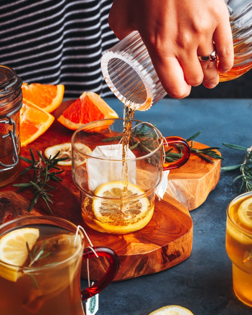 pouring brandy into the cocktail glass