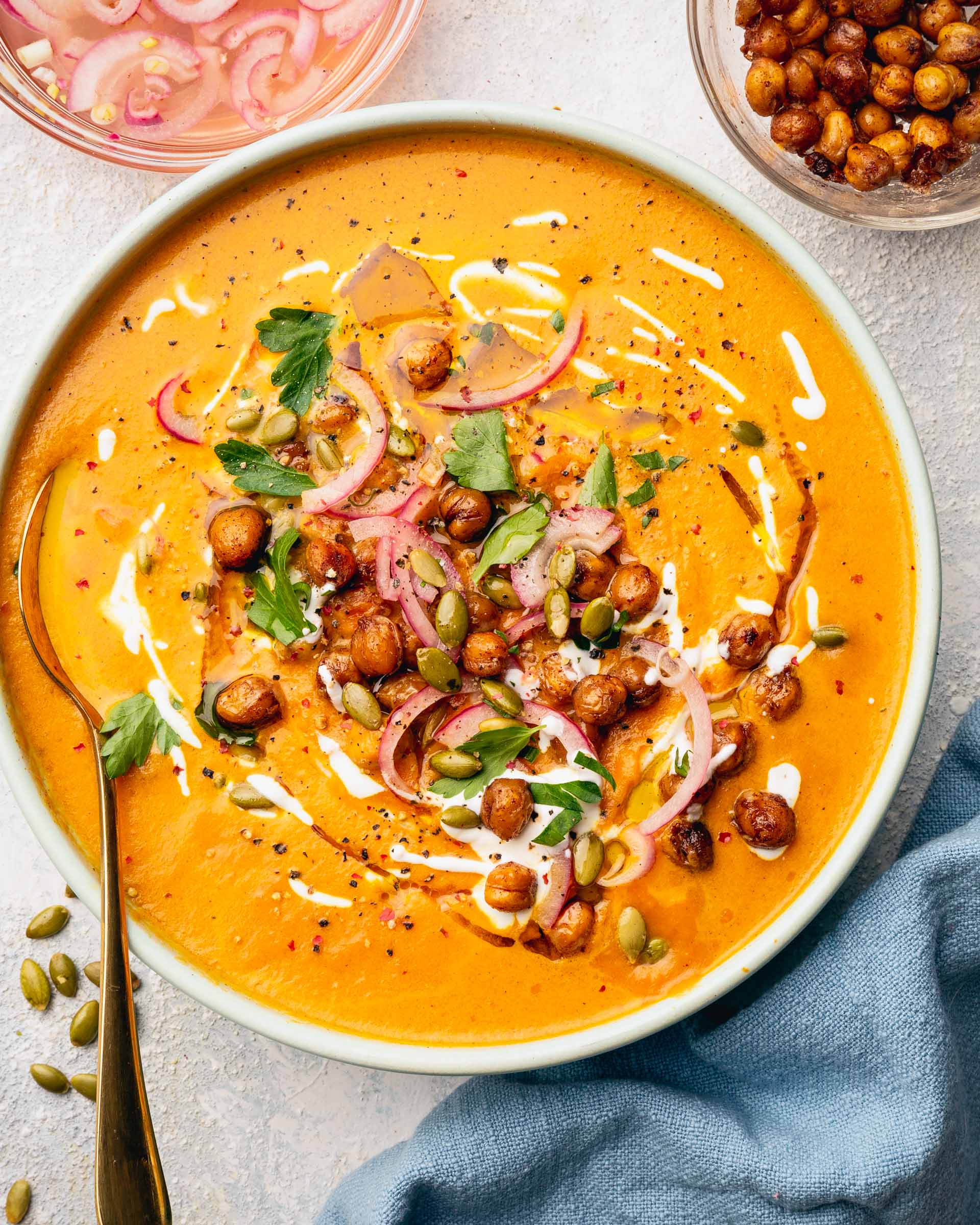 close up of Curried Carrot Soup with Maple Roasted Chickpeas soup