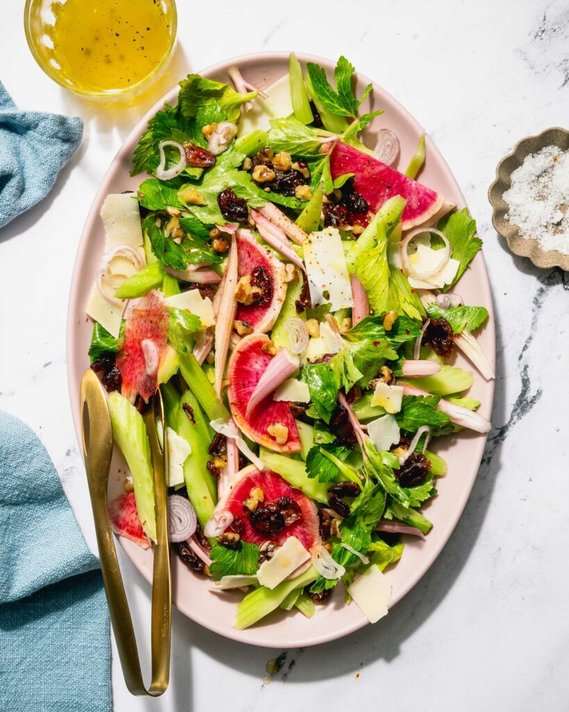 overhead of Celery Salad with cranberries cheese radish