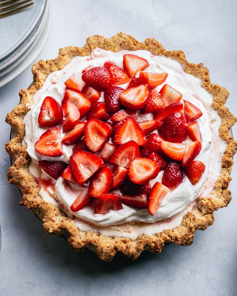 close up of strawberry cheesecake ice cream pie